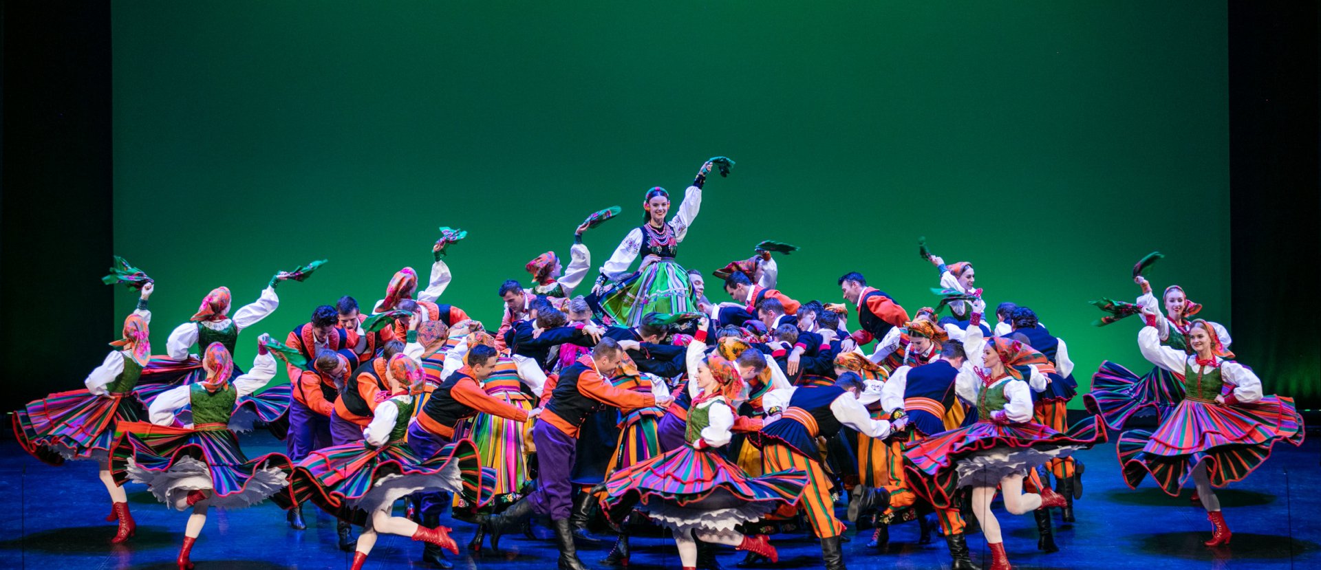 Mazowsze Ensemble on stage, dancing their concert finale.